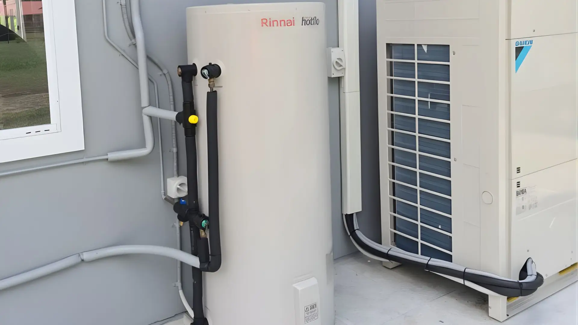 Outdoor heat pump system with hot water tank