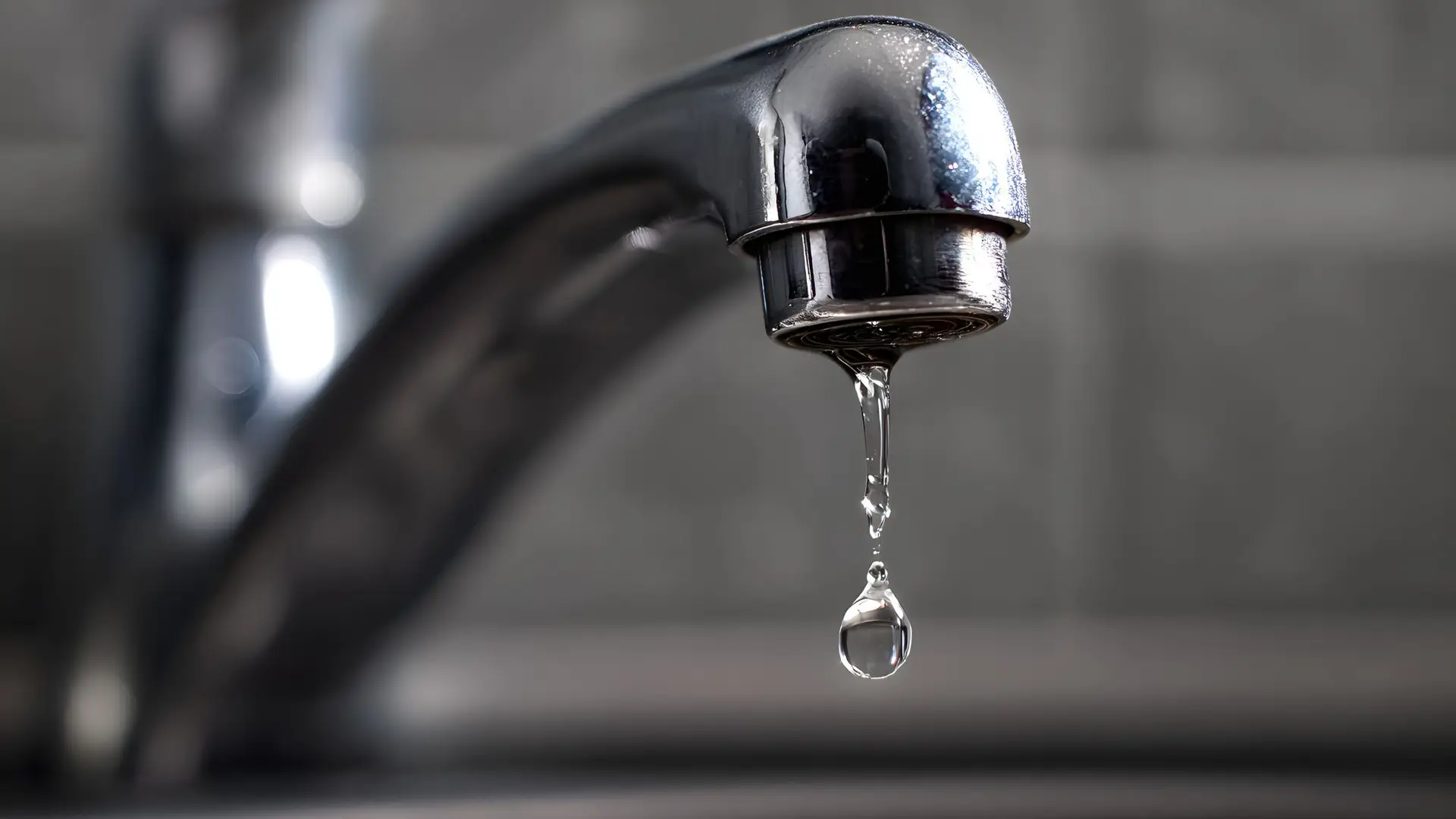 Dripping faucet with water droplet