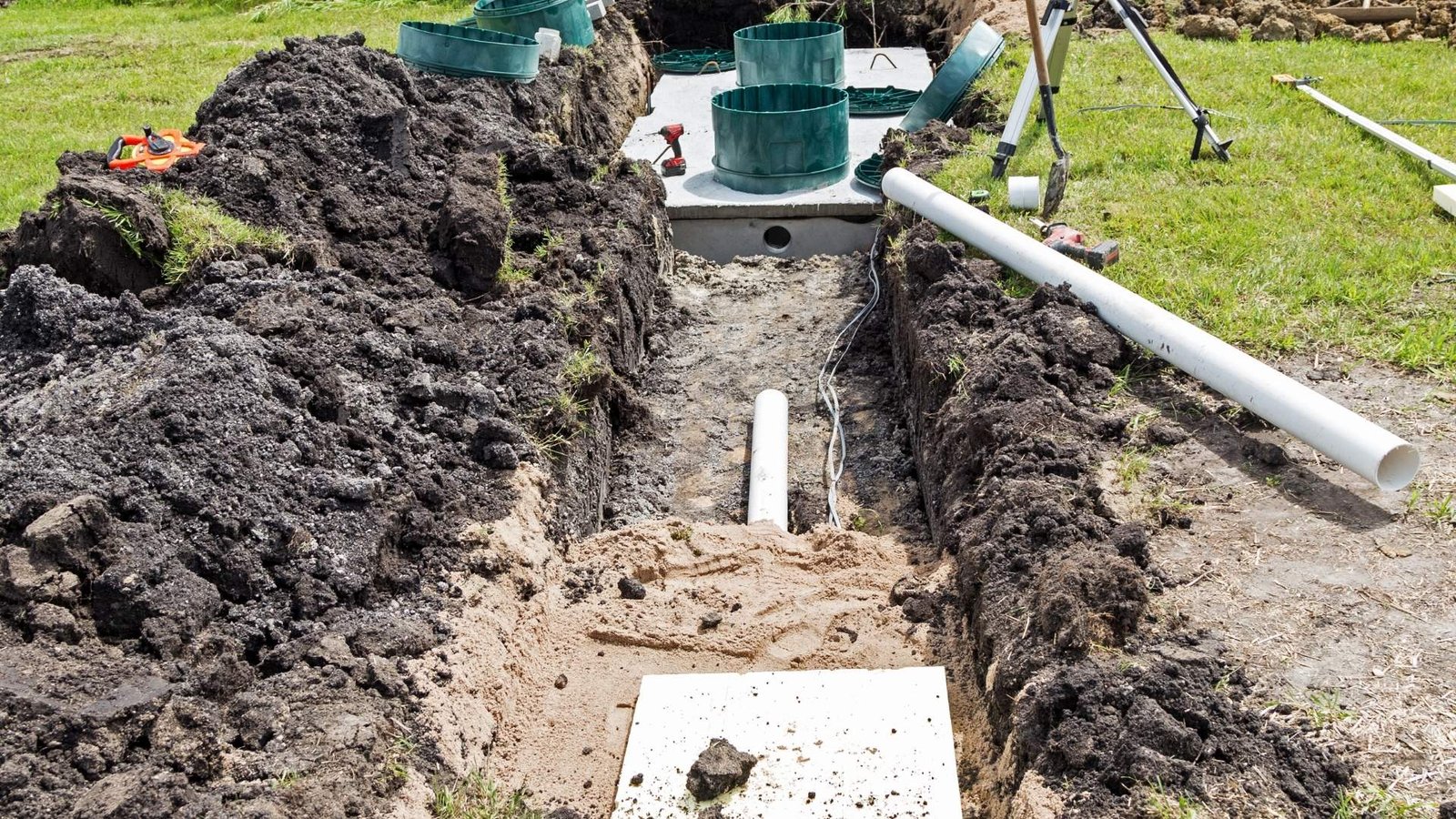 Septic tank installation with trenches and pipes