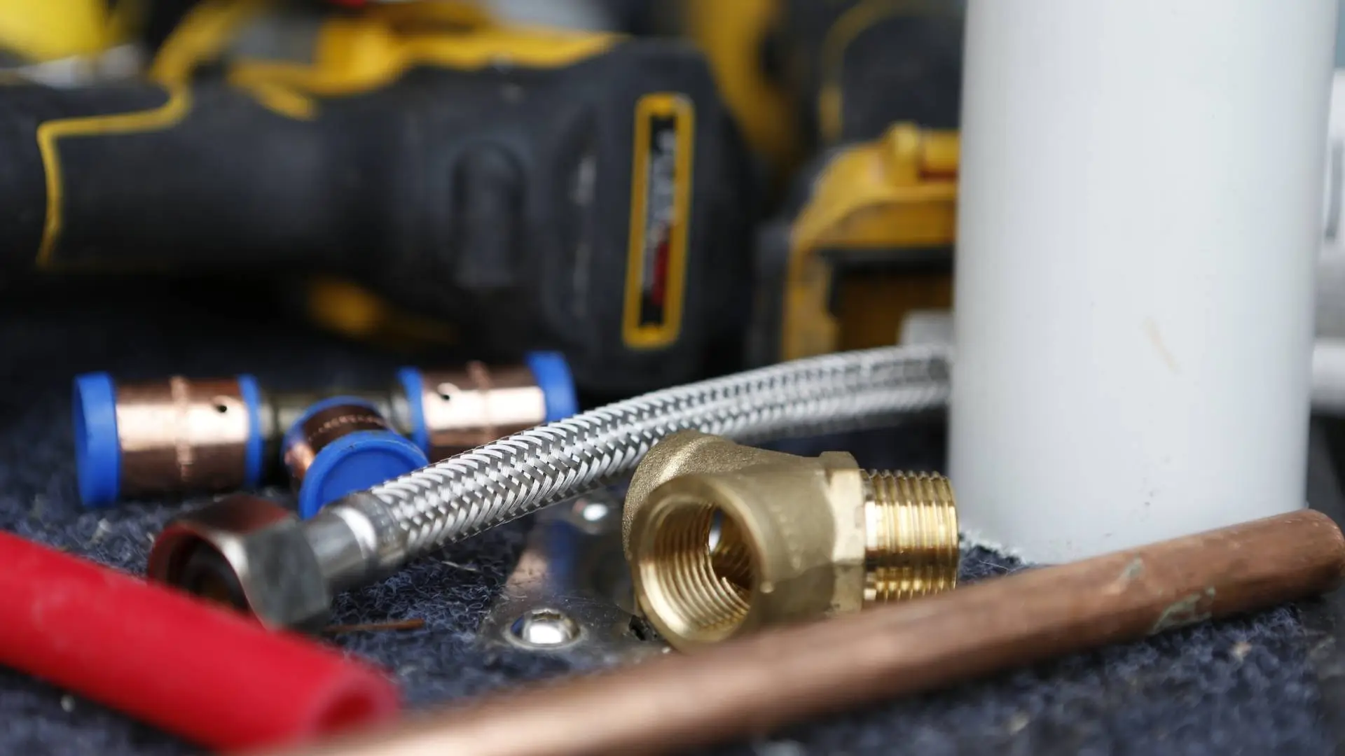 Close-up of plumbing tools and parts.