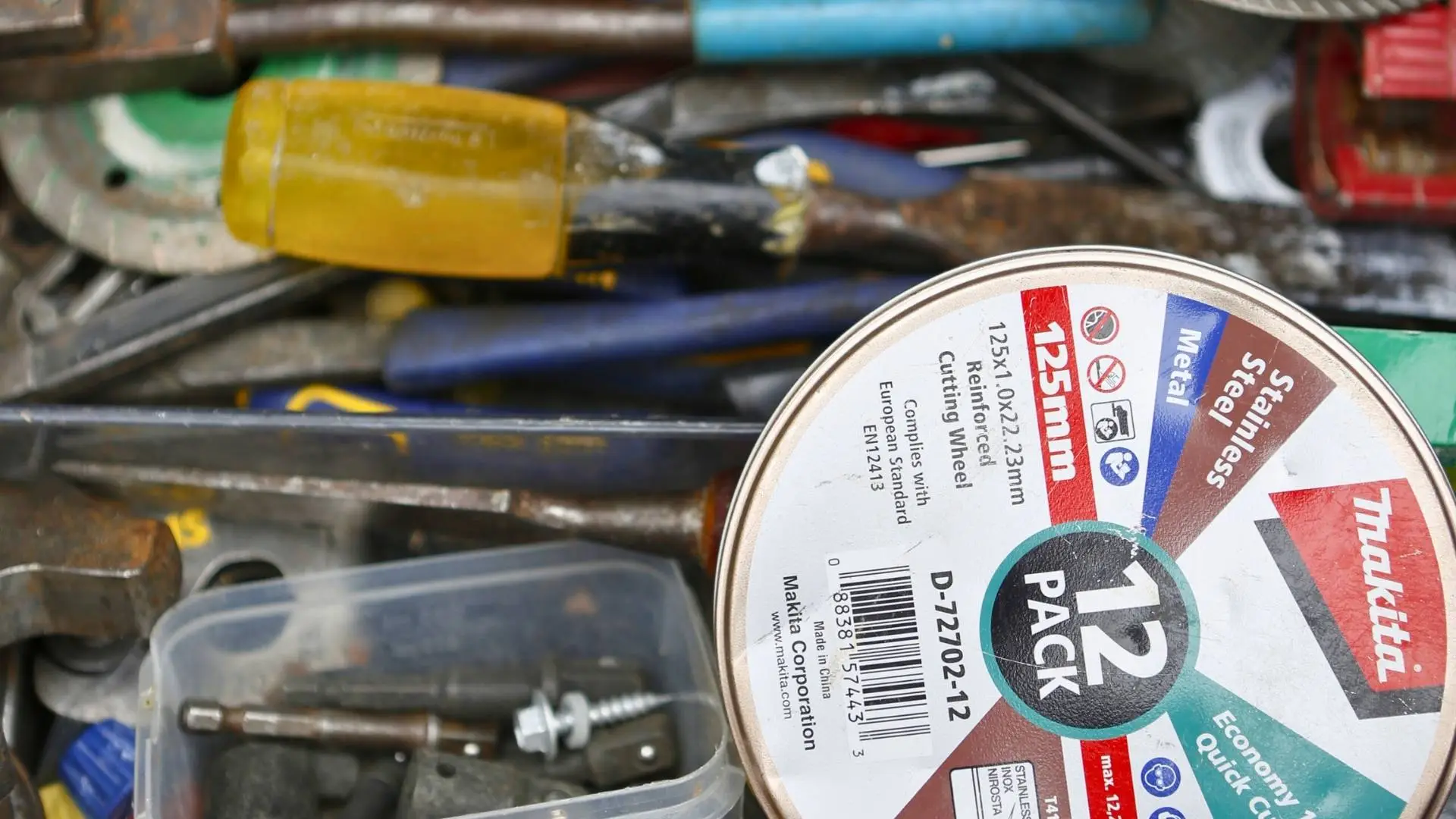 Makita cutting wheel surrounded by various tools.